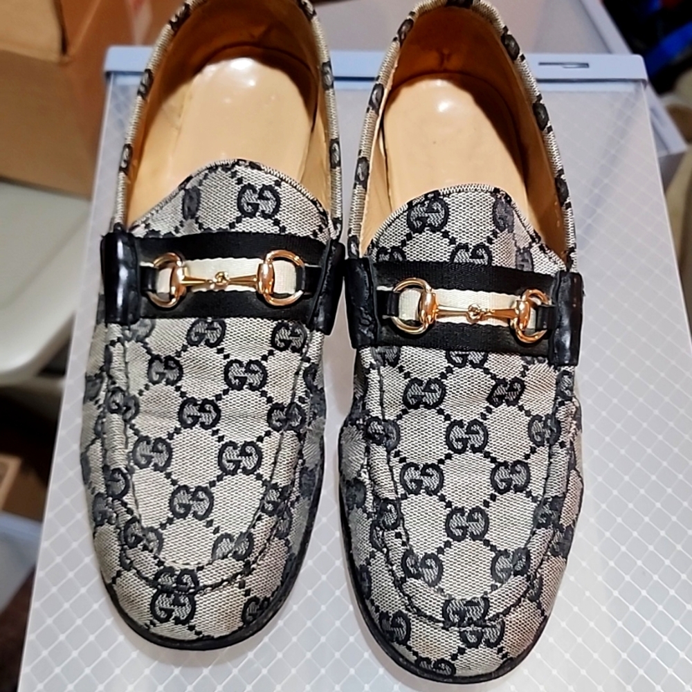 Gucci Beige and Black Loafers with Gold Accents